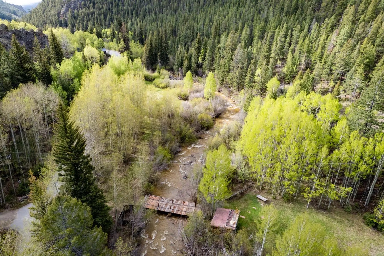 Aerial view of the Majestic Roots property and its mountain setting near Geneva Creek